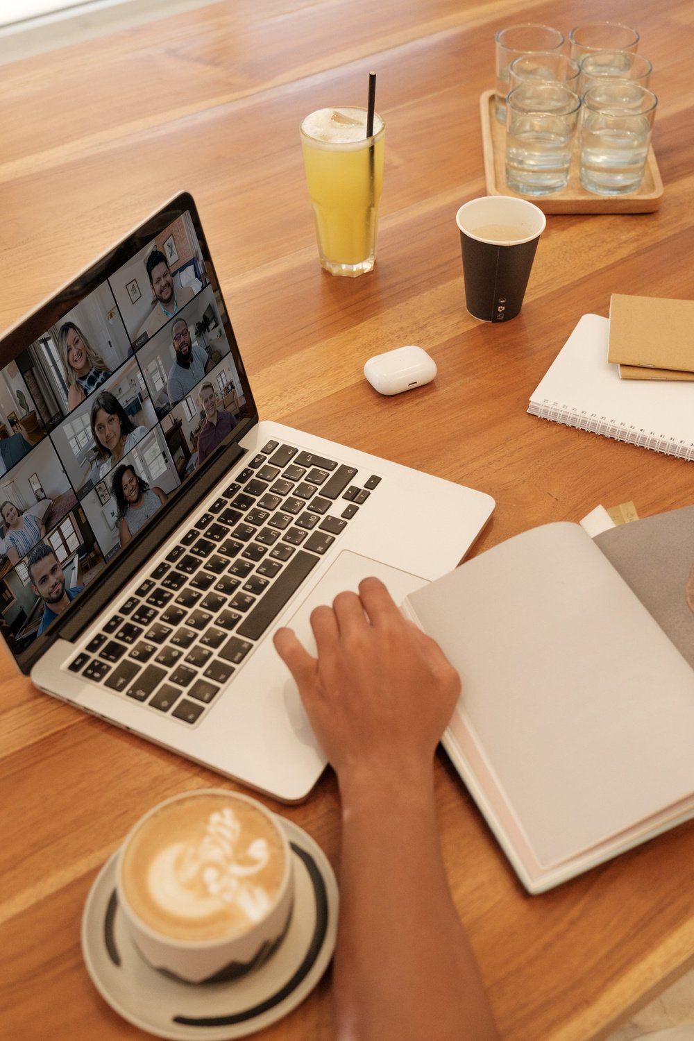 Person Having a Webinar at a Cafe